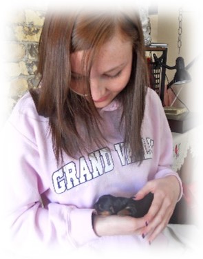Melanie holding baby Ava in 2011